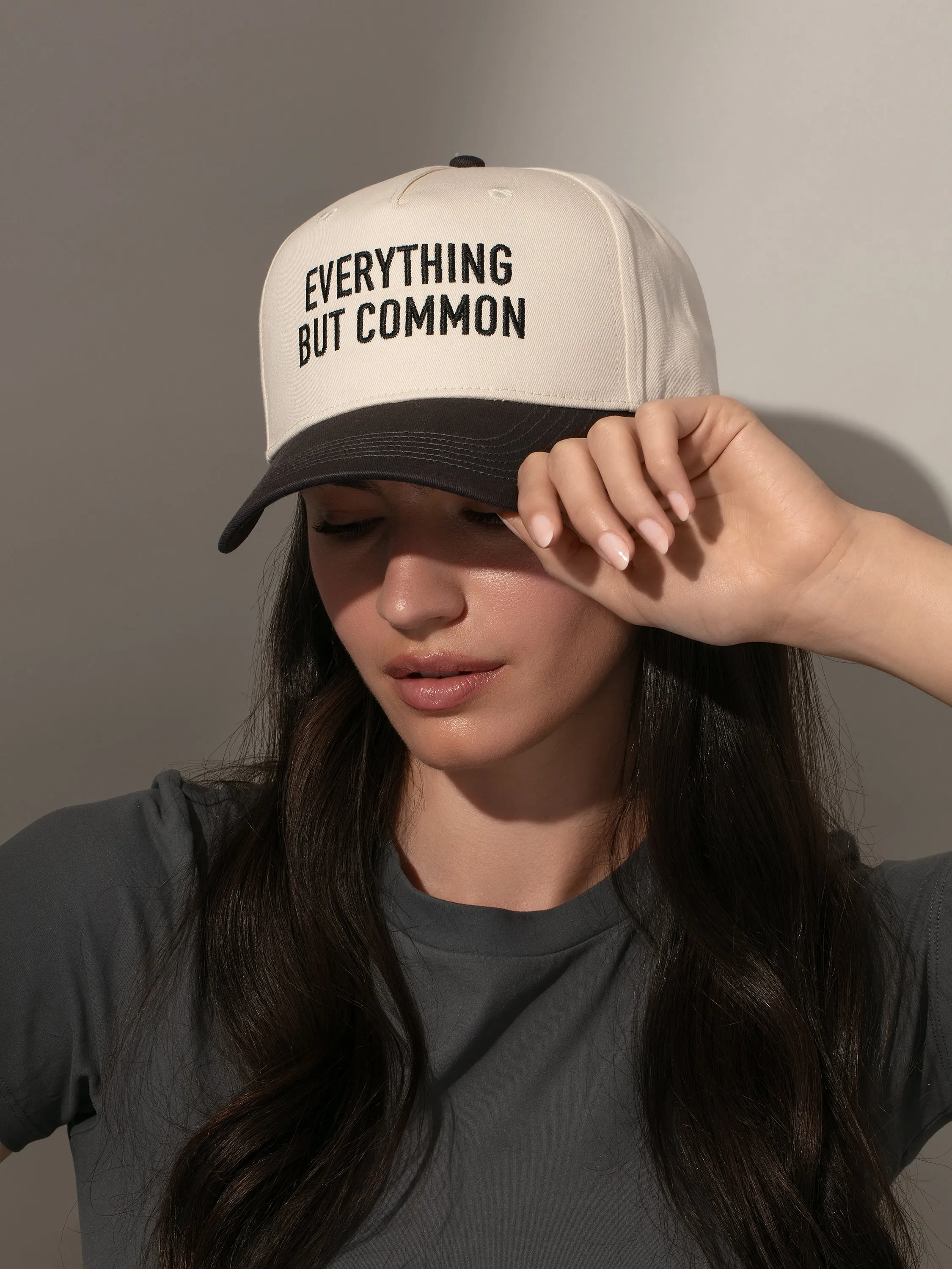 Everything But Common Trucker Hat